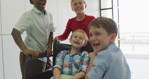 Group of Happy Schoolchildren with a Wheelchair User