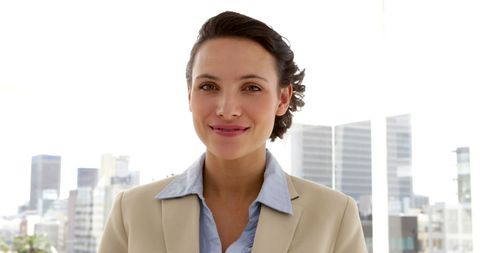 Confident Businesswoman Smiling at Work