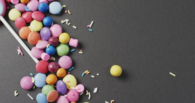 Colorful Candy Spill on Dark Background - Download Free Stock Images Pikwizard.com