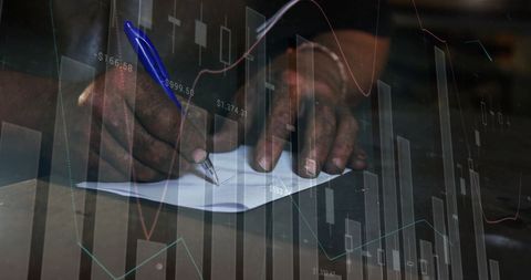 Businessman Analyzing Data with Pen and Paper Amid Financial Graphics - Download Free Stock Images Pikwizard.com