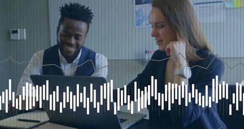 Business Colleagues Collaborating Over Laptop with Data Overlay