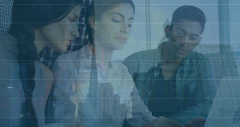 Business Team Analyzing Financial Data Overlapping Graphics
