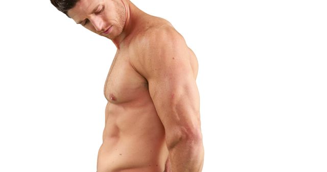 A young Caucasian man is showcased displaying his muscular physique, with copy space - Download Free Stock Photos Pikwizard.com