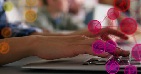 Person typing on laptop with digital social media icons