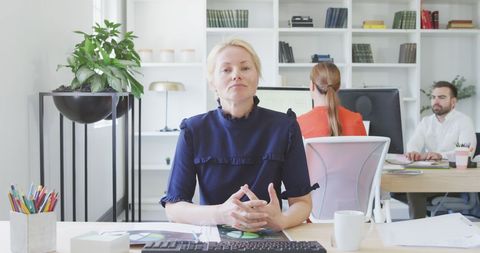 Confident Businesswoman at Modern Workplace - Download Free Stock Images Pikwizard.com