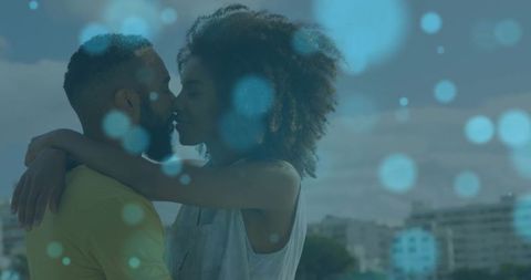 Romantic Urban Rooftop Kiss with Blue Bokeh