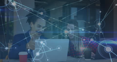 Business Team Connects with Technology in Café Setting