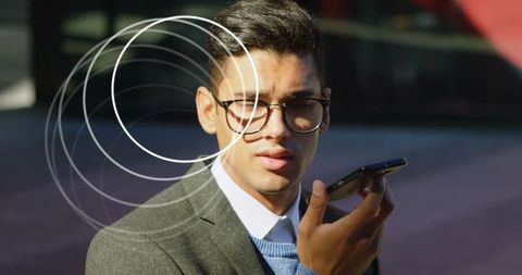 Businessman Engages in Voice Communication via Smartphone