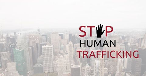 Stop Human Trafficking Awareness Over Urban Skyline