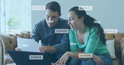 Engaged Couple Donating Online Through Digital Interface