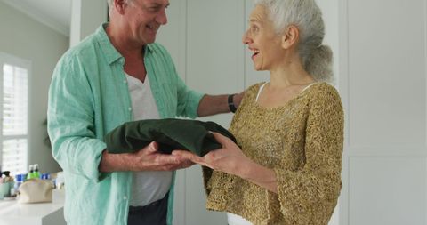 Happy Senior Couple Packing for Travel Adventure