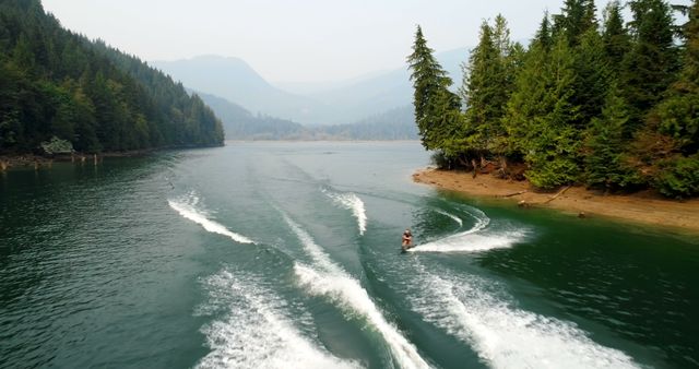 The photo depicts the exhilarating blend of waterskiing and nature's tranquility. - Download Free Stock Photos Pikwizard.com