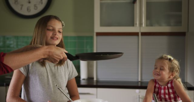 Mother Teaching Daughters How to Cook in Modern Kitchen - Download Free Stock Images Pikwizard.com