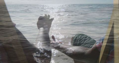 Senior Couple Hands Overlapping on Sunny Beach