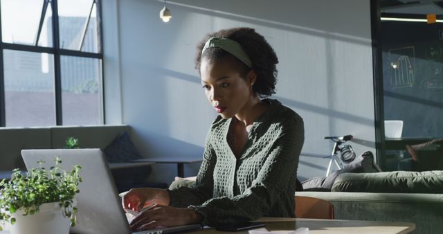 Focused African American Woman Using Laptop in Modern Office - Download Free Stock Images Pikwizard.com