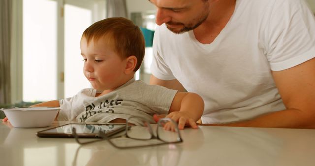 Father and Son During Meal Time at Home - Download Free Stock Images Pikwizard.com