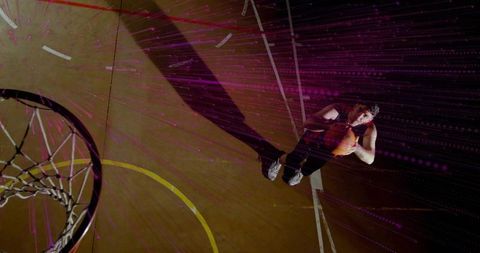 Basketball player preparing to shoot with energetic digital streaks