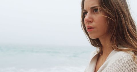 Thoughtful Woman Walking on Misty Beach - Download Free Stock Images Pikwizard.com