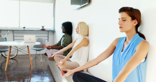 Women Practicing Wall Meditation In Modern Office - Download Free Stock Images Pikwizard.com