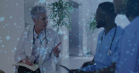 Doctors discuss patient care with virus overlay visual