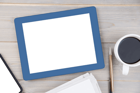 transparent tablet on wooden office desk with coffee and notebook - Download Free Stock Videos Pikwizard.com
