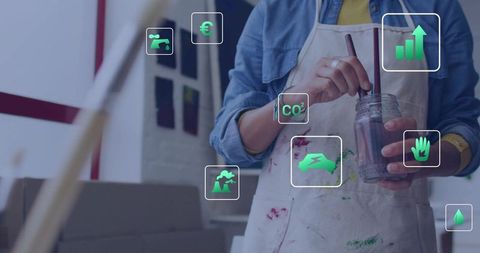 Artist Stirring Paint with Sustainable Conceptual Overlays