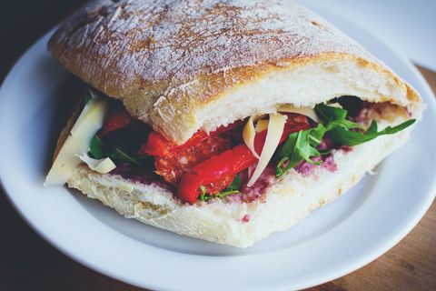 Rustic Ciabatta Sandwich Featuring Roasted Peppers, Arugula and Shaved Cheese