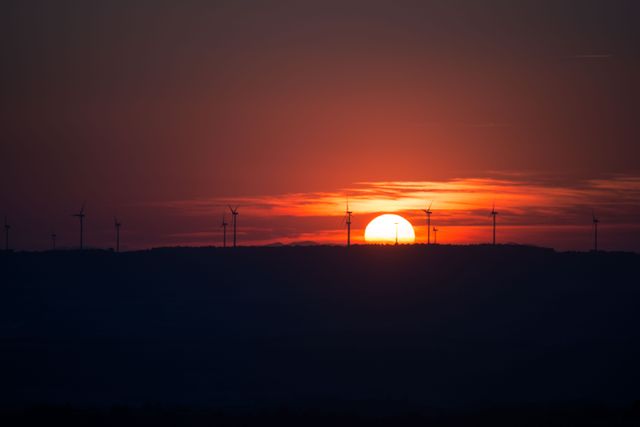 Sunset over Wind Turbines on Horizon - Download Free Stock Photos Pikwizard.com