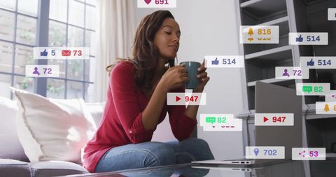 Woman Engaged in Social Media with Coffee in Hand