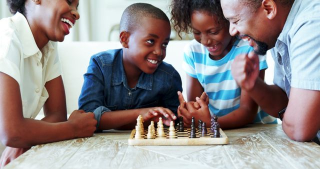 Happy Family Playing Chess at Home - Download Free Stock Images Pikwizard.com