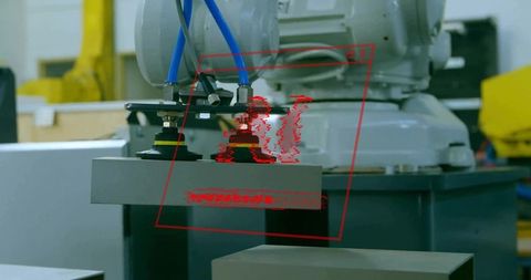 Industrial robot gripper lifting metal block with suction cups and blue pneumatic hoses
