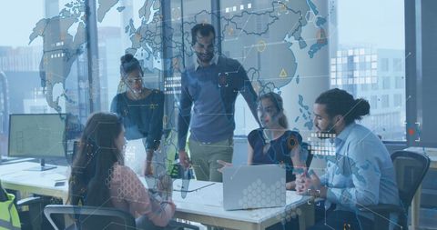 Diverse Business Team Collaborating on Global Data Analytics in Modern Office