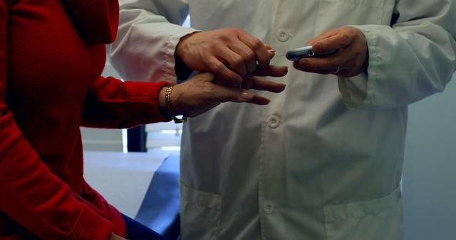 Doctor Checking Female Patient's Blood Sugar Level in Clinic - Download Free Stock Images Pikwizard.com