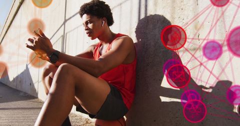 Young man interacting with digital media interface outdoors