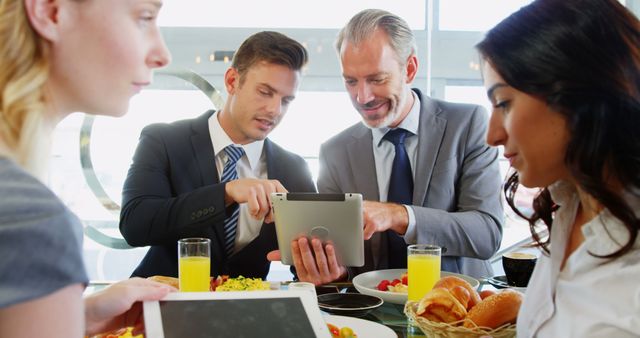 Business Team Discussing Project Over Lunch Meeting - Download Free Stock Images Pikwizard.com