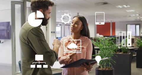 Coworkers Collaborating in Modern Office with Digital Icons Overlay