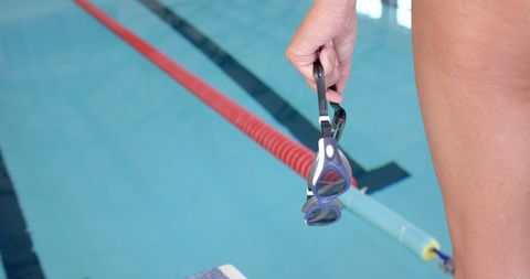 Swimmer Holding Goggles Ready for Pool Workout - Download Free Stock Images Pikwizard.com