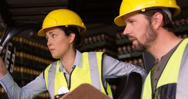 Warehouse Workers Operate Forklift in Industrial Facility - Download Free Stock Images Pikwizard.com