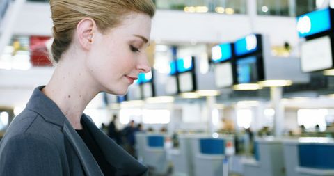 Businesswoman Smiling at Airport Terminal