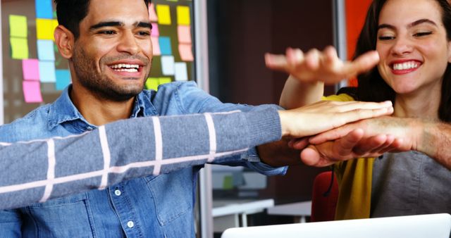 Happy coworkers high-fiving in startup office - Download Free Stock Images Pikwizard.com