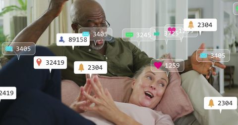 Diverse Senior Couple Engaging Social Media Interactions at Home