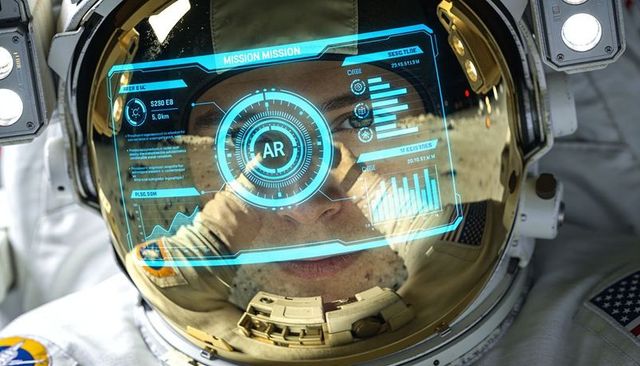 Astronaut examining augmented reality helmet hud through gold visor with flag patch