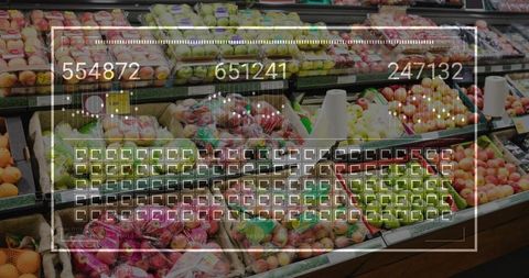 Displaying tiered supermarket produce with red and green apples and digital data overlay