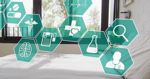 Floating teal hexagon icons over bed representing telemedicine and remote monitoring
