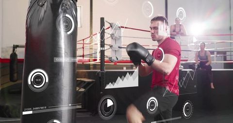 Boxer kicking heavy bag wearing red shirt and black gloves with fitness analytics overlay