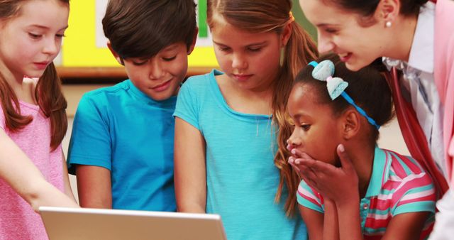 Diverse Group of Children and Teacher Using Laptop in Classroom - Download Free Stock Images Pikwizard.com