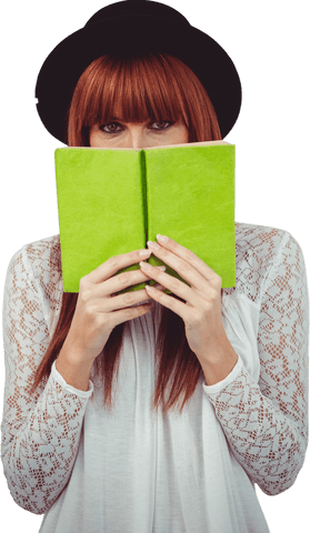 Hipster woman in hat hiding behind green book on transparent background