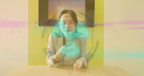 Businesswoman presenting holographic wind turbine display for innovation