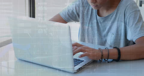 Teen Utilizing Laptop with Data Graph Overlays