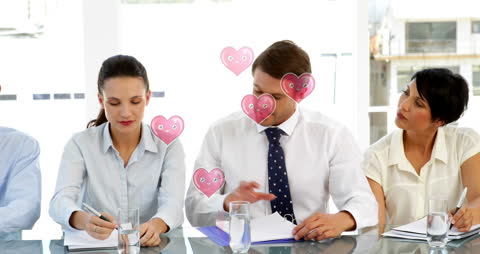 Animated Hearts Floating Over Office Team in Meeting